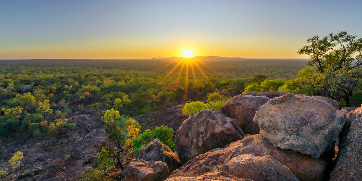 Queensland, Australia. Sun setting, rocks and vegetation.